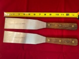 Pair UV Process Supply Lamson Sharp Pro serving spatulas.