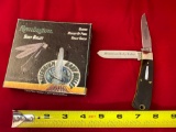2000 Remington Millennium Baby Bullet #R1173 pocket knife, box has some moisture damage.