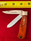 2003 Remington #R1178C pocket knife w/ wooden handle.