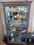 Nice Lighted Howard Miller curio cabinet beveled glass