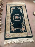 Oriental floral sculptured rug.