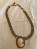 Mother of pearl cameo w/ clip on necklace.
