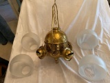 Brass Angle oil lamp w/ (4) shades, hairline crack on one shade.