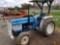 Ford 1310 diesel tractor, 4wd, runs good, ROPS, 3pt, PTO, shows 713 hrs