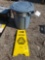 Trashcan and wet floor sign