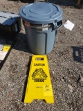 Trashcan and wet floor sign