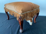 Cowhide upholstered foot stool.