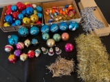 Christmas ornaments, light bulbs, tinsel.