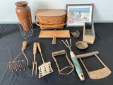 Old kitchen utensils, wooden vase, beach scene print, picnic basket.