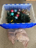 Plastic storage tote & Christmas lights, ornaments.