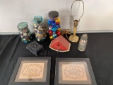 Iron match holder, jars w/ spool thread & clothing buttons, pot metal table lamp, framed needlework