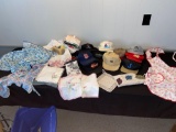 (11) Baseball style hats w/ advertising, (3) aprons, towels, doilies.