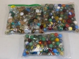 (2) Bags of cat eye & slag marbles, bag of glass decor stones.