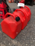 Three plastic gas cans