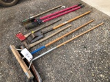 Yard tools, post hole digger, brooms.