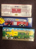 3 diecast vehicles in boxes