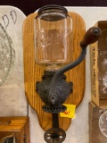 Antique coffee grinder mounted on oak display, Crystal brand