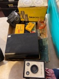 Vintage cameras, Tasco binoculars, advertising tins, lens adapter