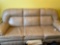 Leather couch, ends recline and black ottoman