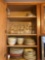 Contents of kitchen cabinet, plates, bowls, stemware