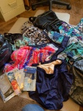 Bag of women?s swim suits and swim caps, about 50 suits, all in like-new condition