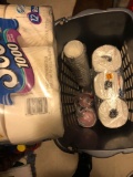 Laundry basket full of toilet paper & solo cups