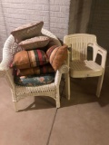 White wicker chair and 2 plastic chairs