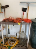 Glass jug, extension cords, tool rack, hose reel, broom