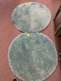 2 blueish green round rugs
