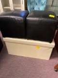 2 black faux leather ottoman cubes and 1 cream colored storage chest