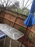Glass top patio table with umbrella and 4 chairs