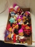 Box of Troll and Precious Moments dolls