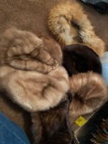 1 flat fur hats and 1 fur purse