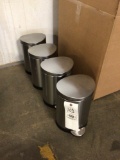 Four stainless trash receptacles