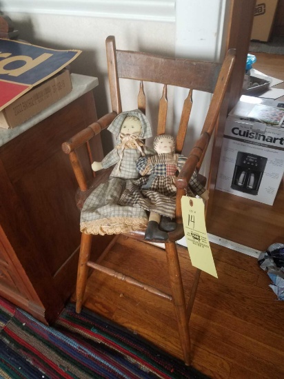 Antique high chair with cloth dolls