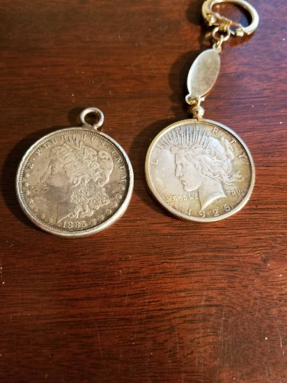 1885o Morgan dollar in necklace case, and 1925 Peace dollar in fab. Bid x 2