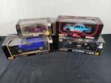 (2) Racing Champions and (2) Maisto Die Casts