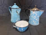 Pair of graniteware coffee pots and cup