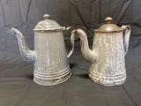 Pair of gray graniteware coffee pots
