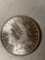 1885 Morgan dollar, AU.