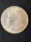 1879 Morgan dollar, AU.