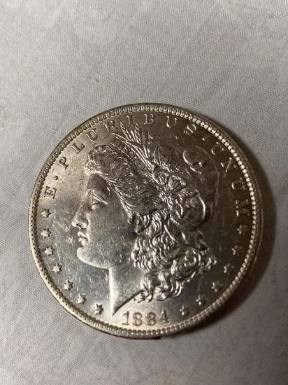 1884-O Morgan dollar, AU.