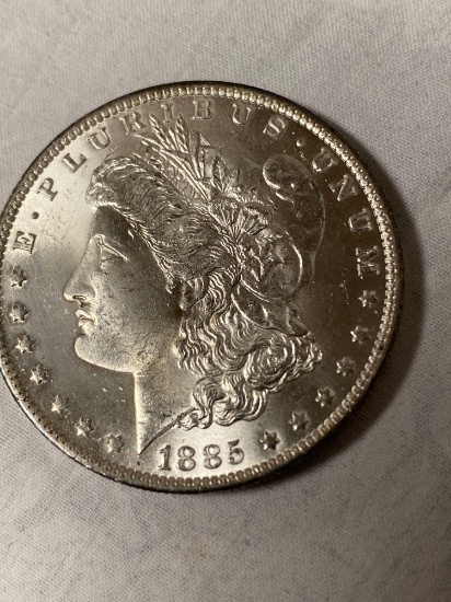 1885-O Morgan dollar, AU.