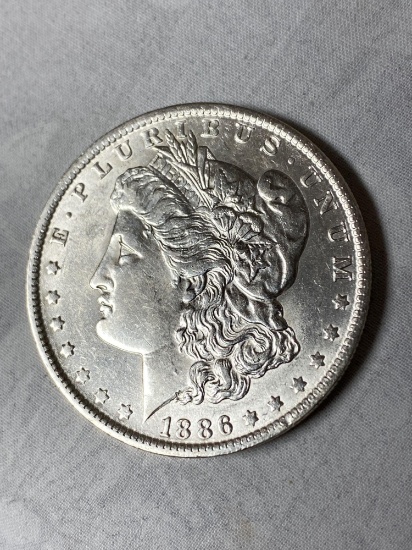 1886-O Morgan dollar, AU.