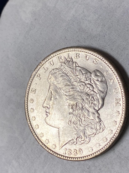 1889-O Morgan dollar, AU.