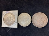 (3) Morgan silver dollars (1878 w/ 7 tail feathers, 1879, 1880). Bid times three.