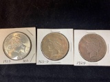 (3) Peace silver dollars (1923, 1923-D, 1924). Bid times three.