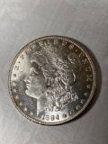 1884 Morgan dollar, AU.