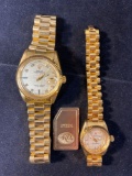 Pair of his & hers Rolex watch copies. Not gold. Has metal tag marked 