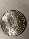 1885 Morgan dollar, AU.